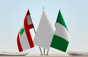 Flags of Lebanon and Nigeria with a white flag in the middle