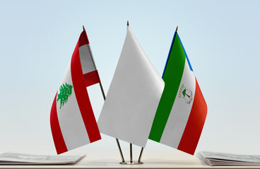 Flags of Lebanon and Equatorial Guinea with a white flag in the middle