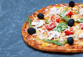 Pizza with ingredients on stone background 
