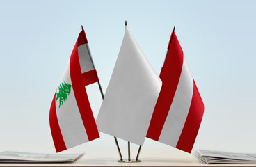 Flags of Lebanon and Austria with a white flag in the middle