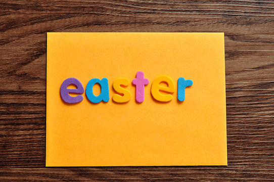 An orange note with the word easter