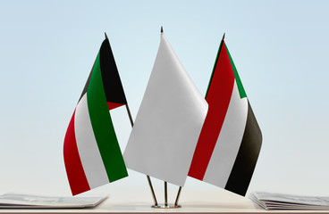 Flags of Kuwait and Sudan with a white flag in the middle