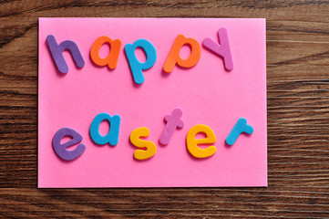 A pink note with the word easter