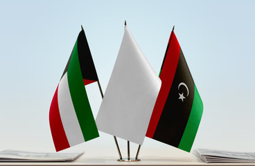 Flags of Kuwait and Libya with a white flag in the middle