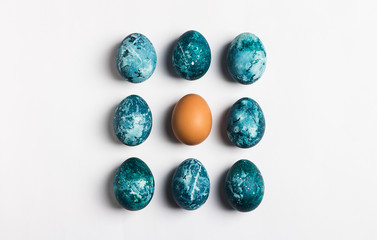 Easter eggs row isolated painted by hand in blue color on white background