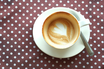 hot  coffee  latte art  in white mug on table