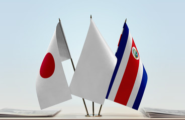 Flags of Japan and Costa Rica with a white flag in the middle