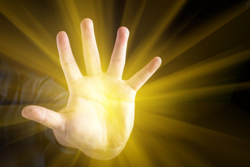 mysterious power glowing light from hand.
