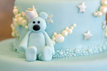 Details of a birthday cake in blue, for boy.