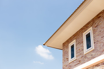 Fototapeta na wymiar House roof against a blue sky