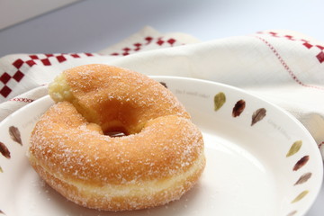 Delicious donuts on dish