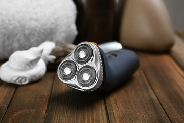 Electric shaver for man on wooden table