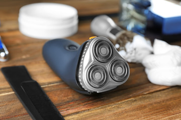 Electric shaver for man on wooden table