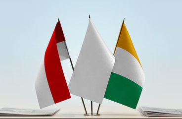Flags of Indonesia and Ivory Coast with a white flag in the middle