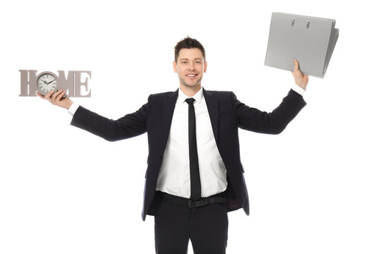 Businessman with word HOME and folders on white background