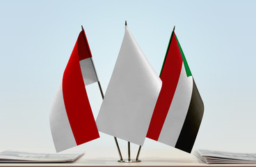 Flags of Indonesia and Sudan with a white flag in the middle