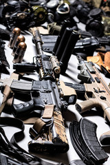 A lot of rifles, guns, grenades, helmets, gas masks, ammunition, vests, devices and other military...