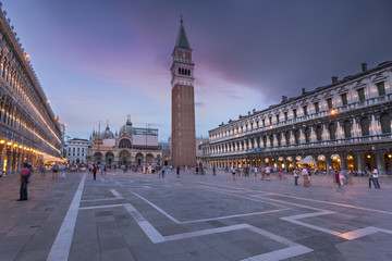 St. Mark Square Campanile and Doges Palace. Clock Tower of Venice against sunset sky, Italy.