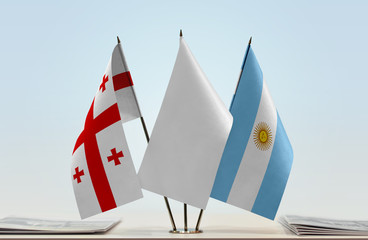 Flags of Georgia and Argentina with a white flag in the middle