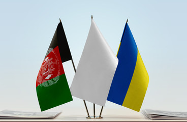 Flags of Afghanistan and Ukraine with a white flag in the middle