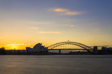 Naklejka premium Sydney skyline with harbour bridge linking south sydney city and north sydney city and opera house
