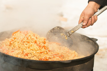 cooking pilaf in the open air
