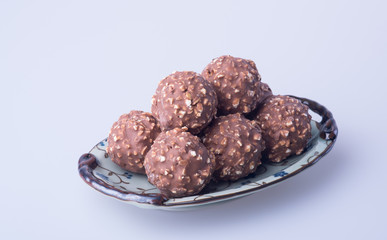 chocolate ball or chocolate bonbon on a background.