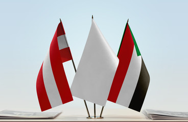 Flags of Austria and Sudan with a white flag in the middle