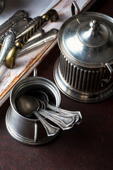 Old silver dishes with accessories for the kitchen