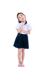 Young preschool child in uniform smiling at studio. Isolated on white background.