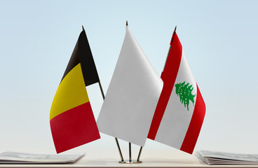 Flags of Belgium and Lebanon with a white flag in the middle