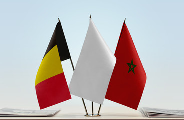 Flags of Belgium and Morocco with a white flag in the middle