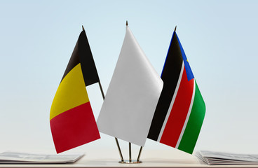 Flags of Belgium and South Sudan with a white flag in the middle