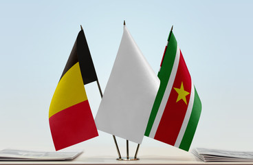 Flags of Belgium and Suriname with a white flag in the middle