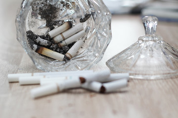 cigarette butts in glass containers