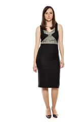 Serious businesswoman standing on white background