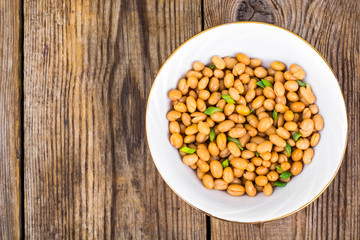 Canned white beans on wooden table