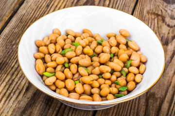 Canned white beans on wooden table