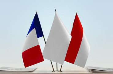 Flags of France and Indonesia with a white flag in the middle