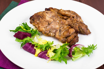 Concept of protein-carbohydrate nutrition. Chicken meat with lettuce