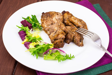Concept of protein-carbohydrate nutrition. Chicken meat with lettuce