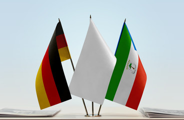 Flags of Germany and Equatorial Guinea with a white flag in the middle