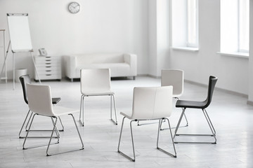 Chairs in room prepared for group psychotherapy session