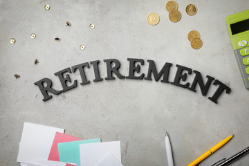 Word "Retirement" on grey background. Pension planning