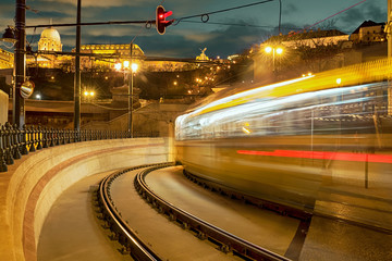 Tramway, luminous trace of moving tram at night