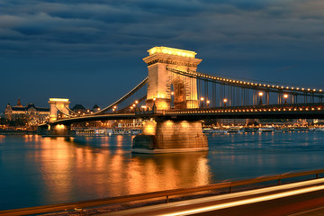 Chain bridge in Budapest at night, traffic motion lights