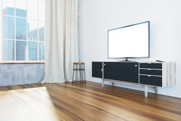 TV set on a black cabinet living room, side view