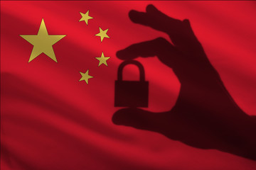 China closed lock in the hand. Import and export of goods from the world market of trade is...