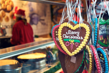 Gingerbread hearts. Christmas gingerbread heart - shaped cookies decoration with words "Merry Christmas". Lebkuchen are popular in German outdoor Christmas markets