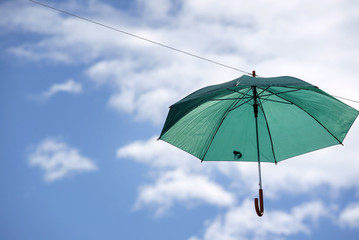 umbrella flying on a blue sky